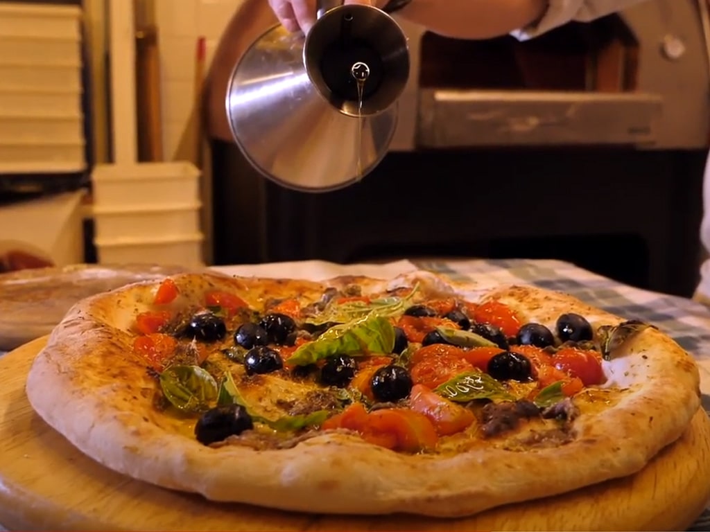 TitoloTruffle Pizza with Cherry Tomatoes, Black OIives, Capers Anchovies with Truffle